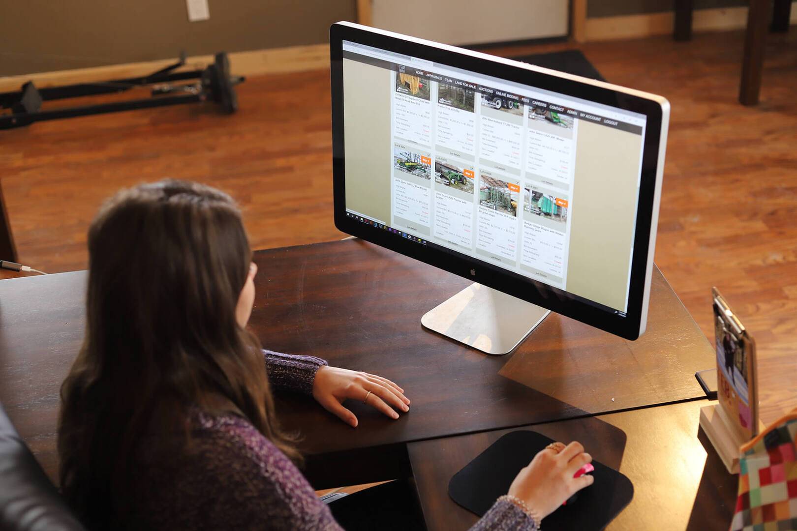 A team member works at a computer