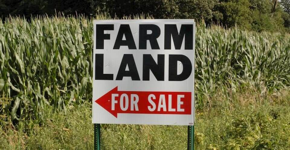 A Farm Land For Sale sign