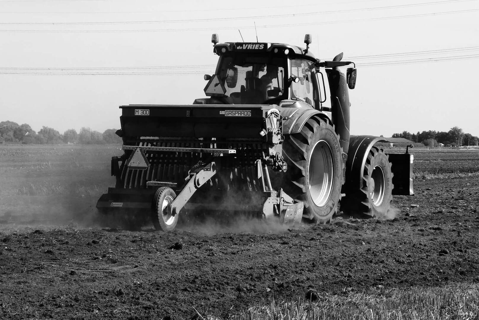 A tractor moves through a field.