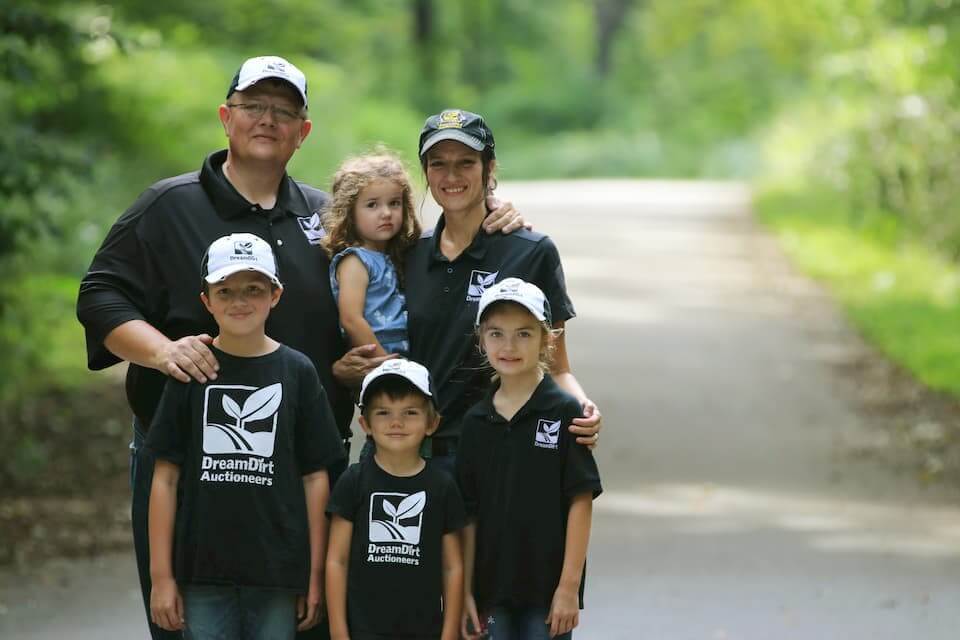 Jason Smith and Nicole Smith pose with their family.