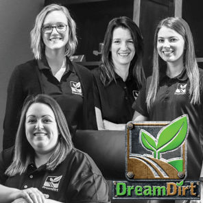 Four DreamDirt team members smile for a photo.