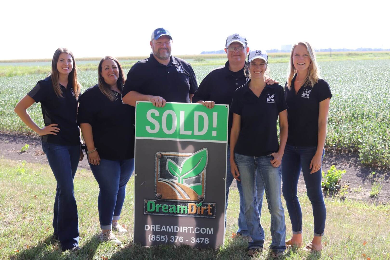 auctioneers with sign