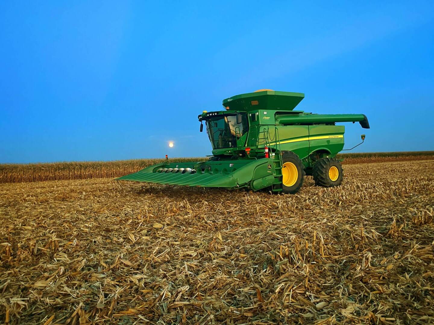 Combine with farmland in iowa